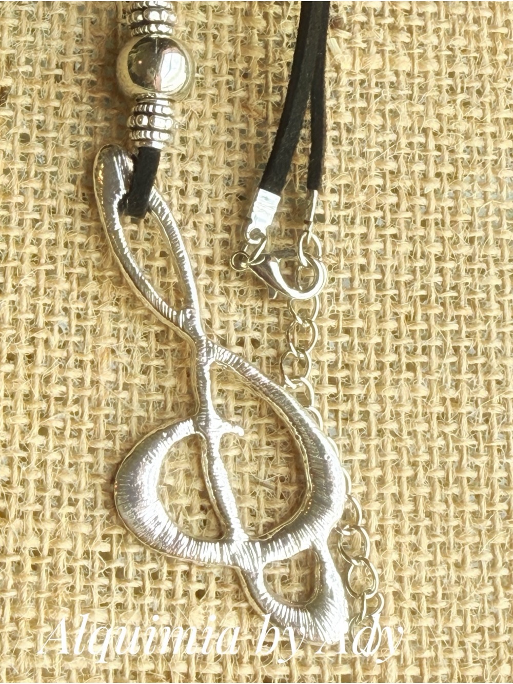 Alquimia Silver Treble Clef Necklace on Black Cord